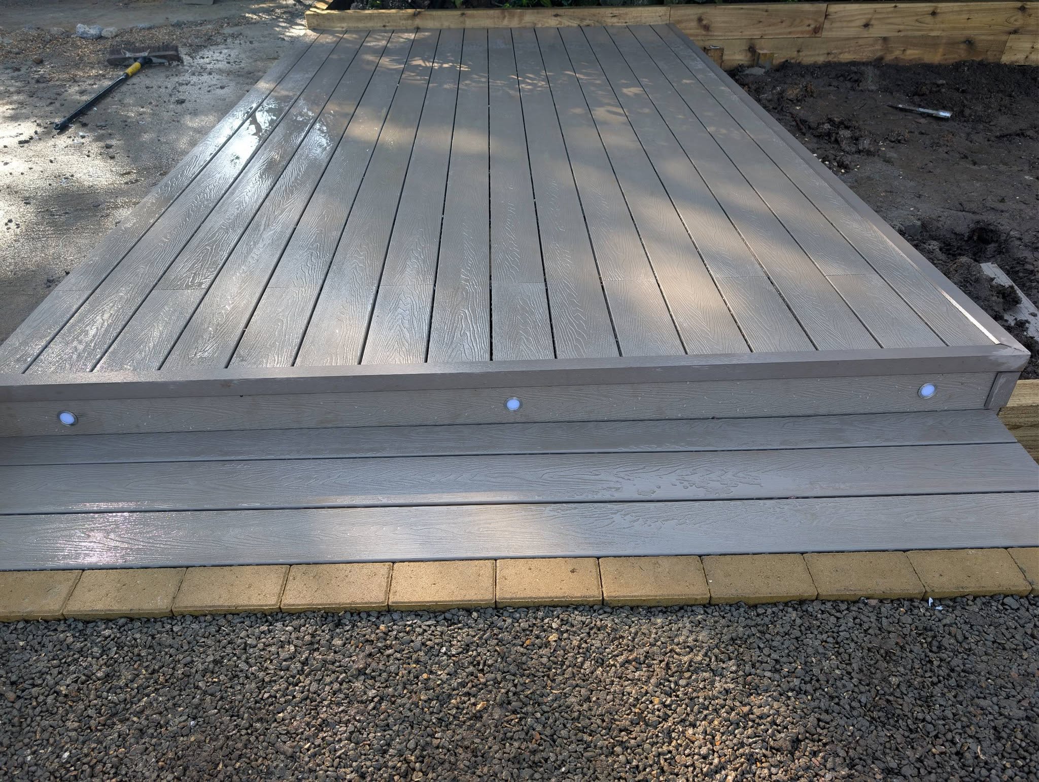 Composite decking with steps and integrated lighting