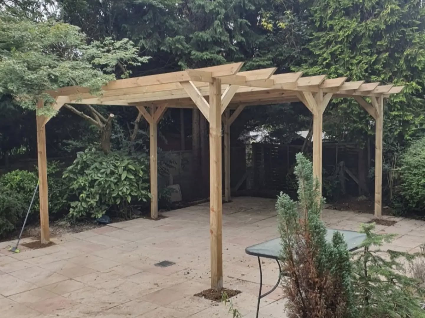 Timber pergola build over a garden patio